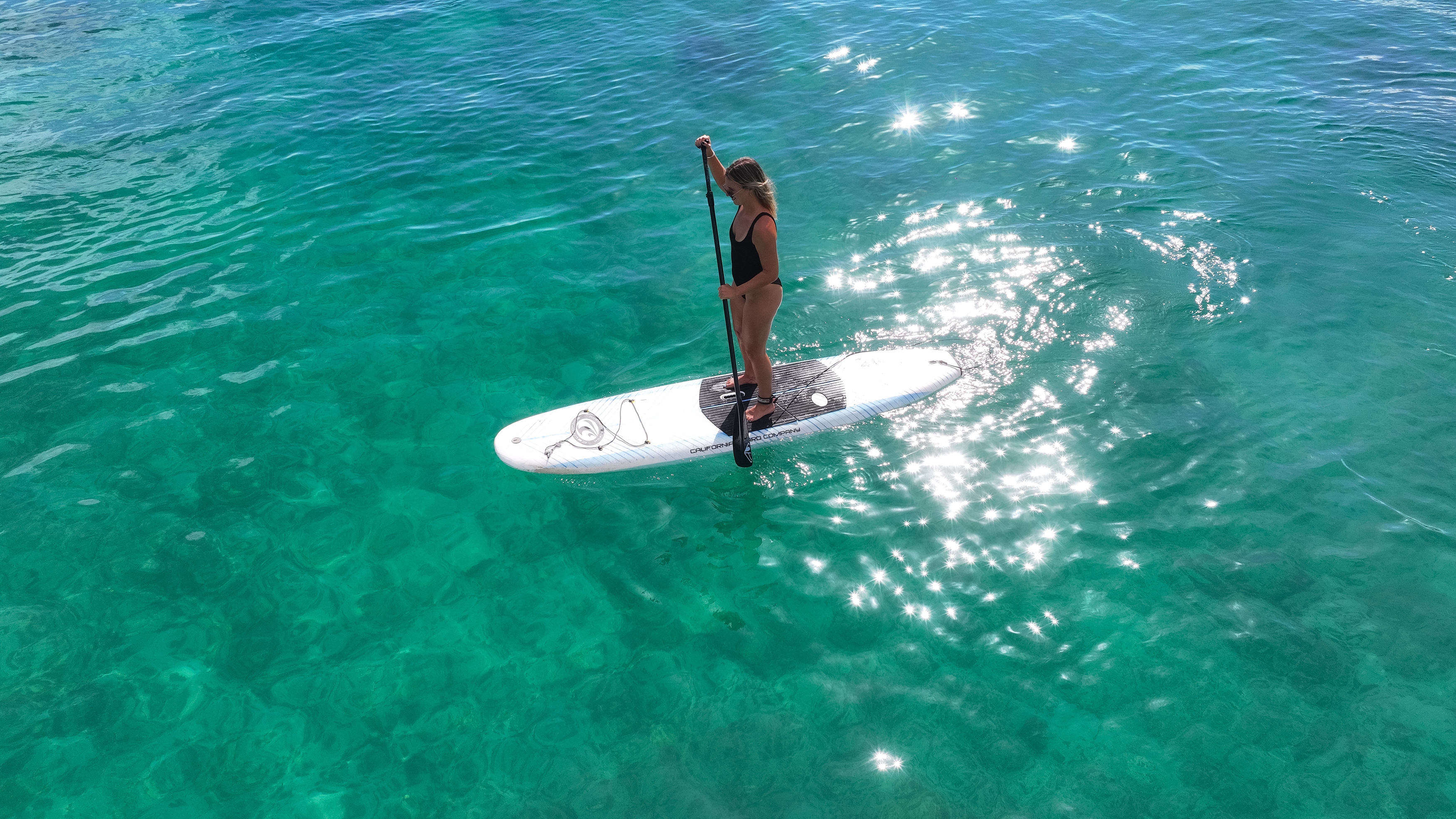 a woman on a surfboard in the water